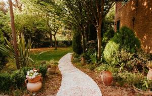 A garden outside Italian Experience-Villa Millefiori