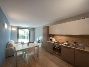 a kitchen with a table and a counter top at Casa Chiara by Holiday World in Limone Piemonte