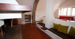 a living room with a couch and a fireplace at Italian Experience- Holiday Home Giannella in Giannella