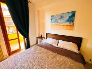 Voodi või voodid majutusasutuse Italian Experience-Numana Suite Apartment toas
