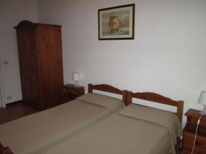 Ένα ή περισσότερα κρεβάτια σε δωμάτιο στο Italian Experience-Giannella Holiday Apartament