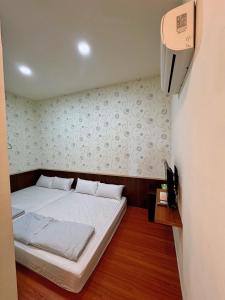 Postel nebo postele na pokoji v ubytování Fish Luck Guesthouse