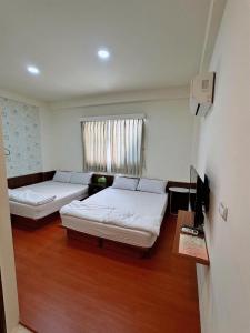 Postel nebo postele na pokoji v ubytování Fish Luck Guesthouse