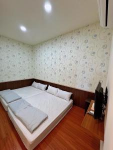 Postel nebo postele na pokoji v ubytování Fish Luck Guesthouse