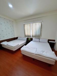 Postel nebo postele na pokoji v ubytování Fish Luck Guesthouse