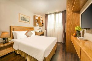 Voodi või voodid majutusasutuse Parkside Sunline Hotel toas