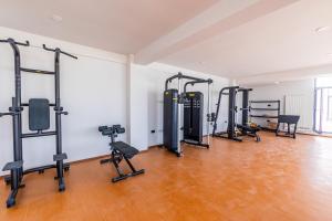 a gym with a row of treadmills and machines at Miramar - Alezzi Infinity Beach Resort in Năvodari