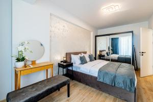 a hotel room with a bed and a mirror at Miramar - Alezzi Infinity Beach Resort in Năvodari +47 photos
