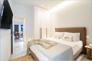 Postel nebo postele na pokoji v ubytování Inia Apartments