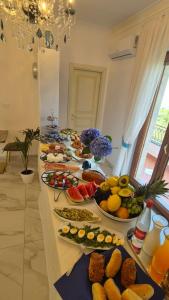 a buffet with many plates of food on a table at La Vigna del Vento in Casola di Napoli