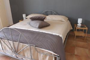 Posteľ alebo postele v izbe v ubytovaní L'albero Dei Limoni B&B