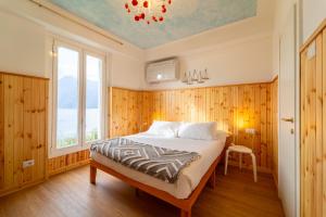 Кровать или кровати в номере Villa Perledina by Wonderful Italy