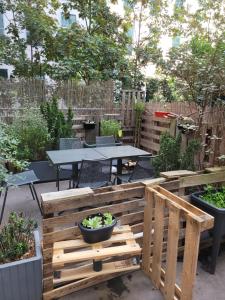 a patio with a table and a table and some plants at ibis budget Paris Porte de Vincennes in Paris