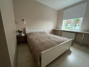 Postel nebo postele na pokoji v ubytování Apartment Jõesuu