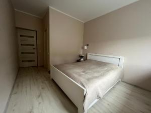 Postel nebo postele na pokoji v ubytování Apartment Jõesuu