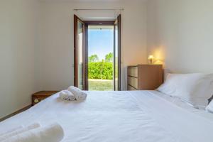 A bed or beds in a room at Italian Experience-CasAmare