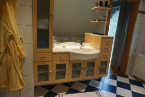 a bathroom with a sink and a mirror at Michel in Trois-Ponts