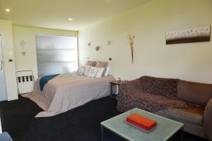 Postel nebo postele na pokoji v ubytování Platinum Lodge