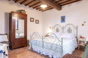 A bed or beds in a room at Italian Experience-Il Borgo Apartment