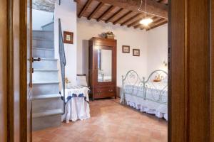 Postel nebo postele na pokoji v ubytování Italian Experience-Il Borgo Apartment