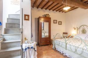 Postel nebo postele na pokoji v ubytování Italian Experience-Il Borgo Apartment