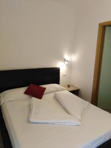 Postel nebo postele na pokoji v ubytování Hotel Vienna