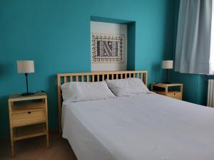 A bed or beds in a room at Cascina in Alto Piemonte / Piedmont countryhouse