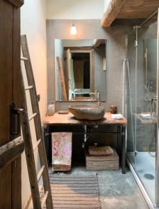 a bathroom with a sink and a mirror at Affittacamere Montagne Verdi in Varallo