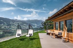 a house with a balcony with a view of the mountains at Moarlhof - Farm Nature Resort in Castelrotto