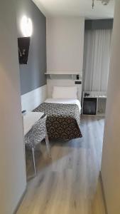 Postel nebo postele na pokoji v ubytování Hotel Continental