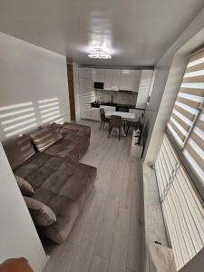a bedroom with a large bed and a dining room at Filip residence in Cluj-Napoca