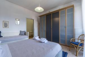 Giường trong phòng chung tại Italian Experience-Florence Suite Retreat