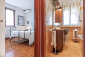 a bathroom with a bed and a sink in a room at Italian Experience- Casale Al Mare in Loreto +48 photos