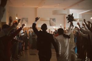 a group of people dancing in a room with their hands in the air at Hospedium Hotel Valles de Gredos Golf in Talayuela +66 photos