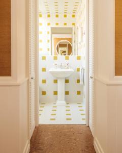 a white bathroom with a sink in a hallway at LILOU in Hyères +64 photos