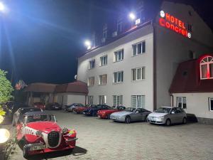 a row of cars parked in front of a hotel at Hotel Concrete in Ungheni