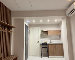 a small kitchen with a sink and a counter at Siel Residences in Perea