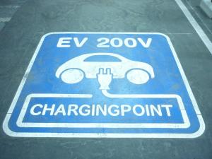 a sign for a car charging point on a parking lot at APA Hotel Honhachinohe in Hachinohe