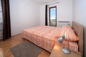 Postel nebo postele na pokoji v ubytování Apartments Beakovic