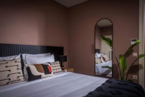 Un ou plusieurs lits dans un hébergement de l'établissement Centro Vero Suites by Omilos Hotels