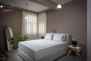 Un ou plusieurs lits dans un hébergement de l'établissement Centro Vero Suites by Omilos Hotels