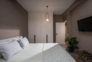 Un ou plusieurs lits dans un hébergement de l'établissement Centro Vero Suites by Omilos Hotels