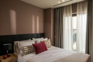 Un ou plusieurs lits dans un hébergement de l'établissement Centro Vero Suites by Omilos Hotels