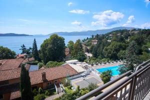 a view from the balcony of a house with a swimming pool at Selva Coccinella in Cissano