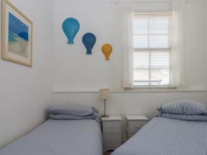 En eller flere senge i et værelse på The Old Greengrocers