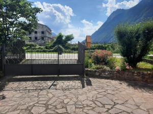 a fence with a gate in front of a building at La Rosa di Emma in Porlezza +35 photos
