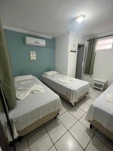 Postel nebo postele na pokoji v ubytování Pousada Executiva