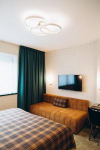 TV a/nebo společenská místnost v ubytování Hotel Vodník