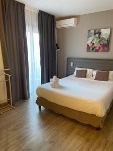 Letto o letti in una camera di Hôtel Pyrène