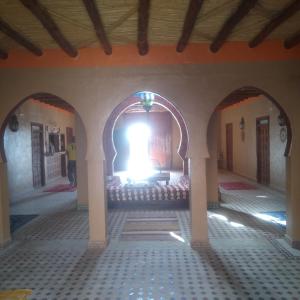 Una cama o camas en una habitación de Riad Berber Merzouga
